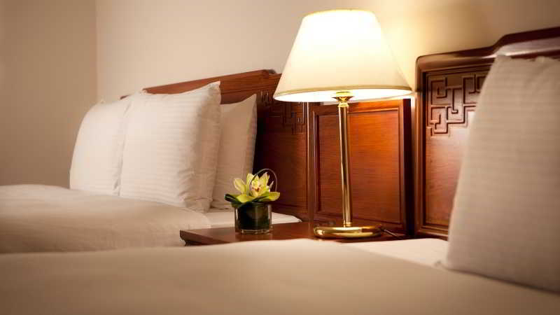 The Howard Prince Hotel Taichung Exterior photo A lamp on a bedside table